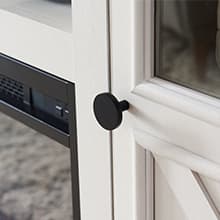 JXQTLINGMU Fireplace TV Stand for 80 Inch TV, Farmhouse Highboy Entertainment Center w/23'' Electric Fireplace & Cross Barn Door, Large TV Console for TVs Up to 80", 70 inches, White