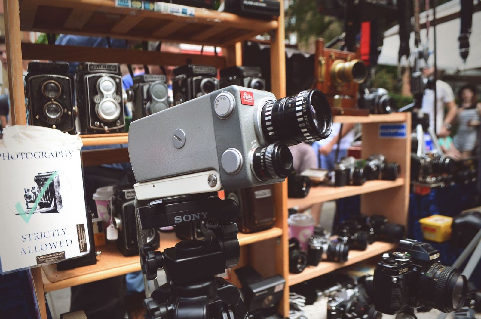 Best 16mm film cameras shown as a vintage movie camera loaded with a film spool