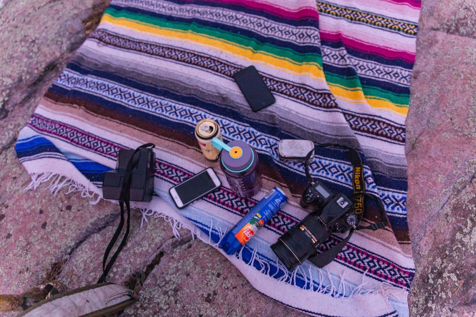 Best AA batteries for trail cameras shown next to a trail camera
