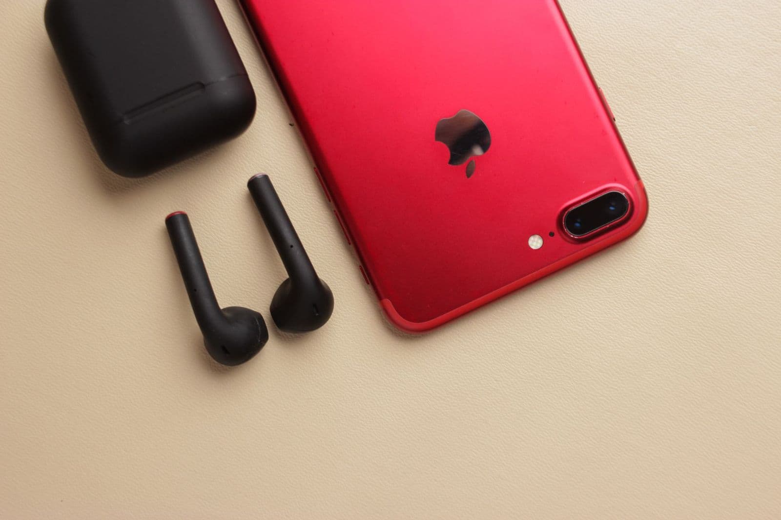 Best airpods for android phones: sealed and open earbuds beside an Android phone