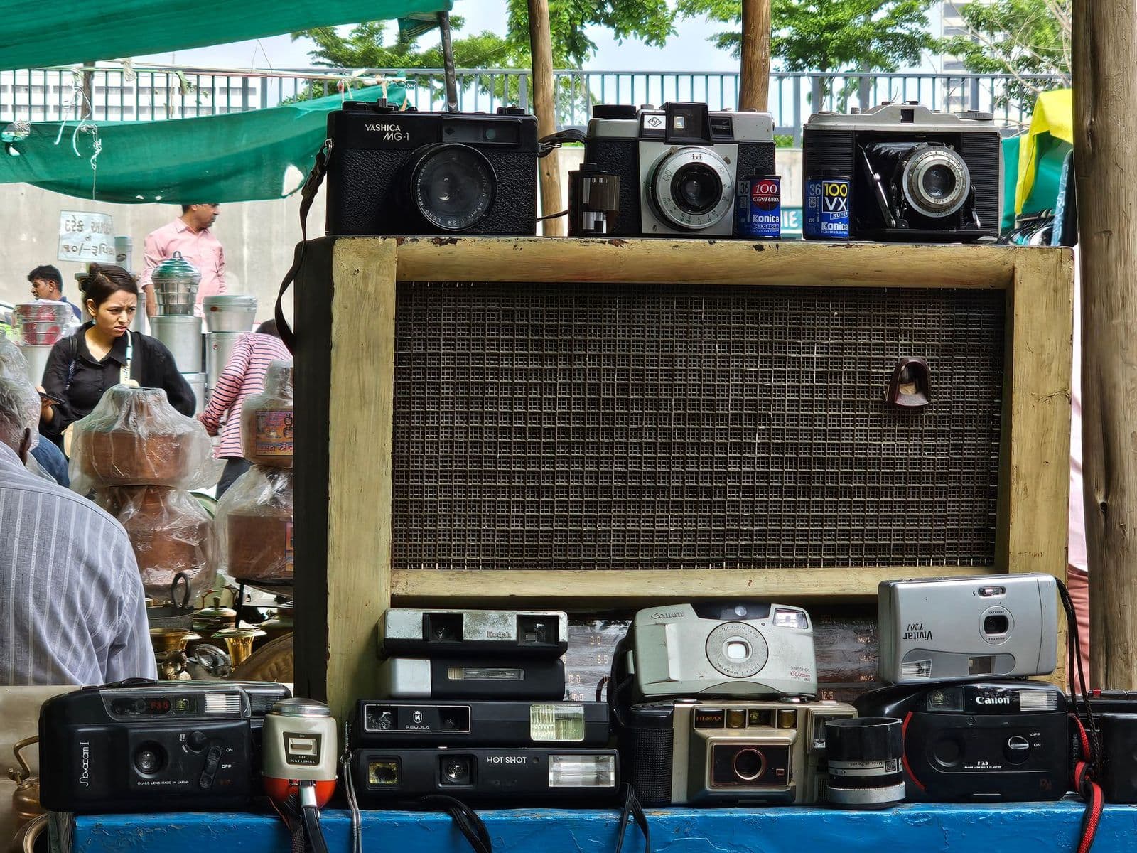 Best antique cameras: a vintage folding film camera on a wooden shelf
