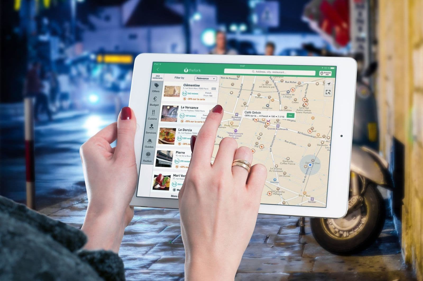 Person using the best applications for tablets on a tablet screen